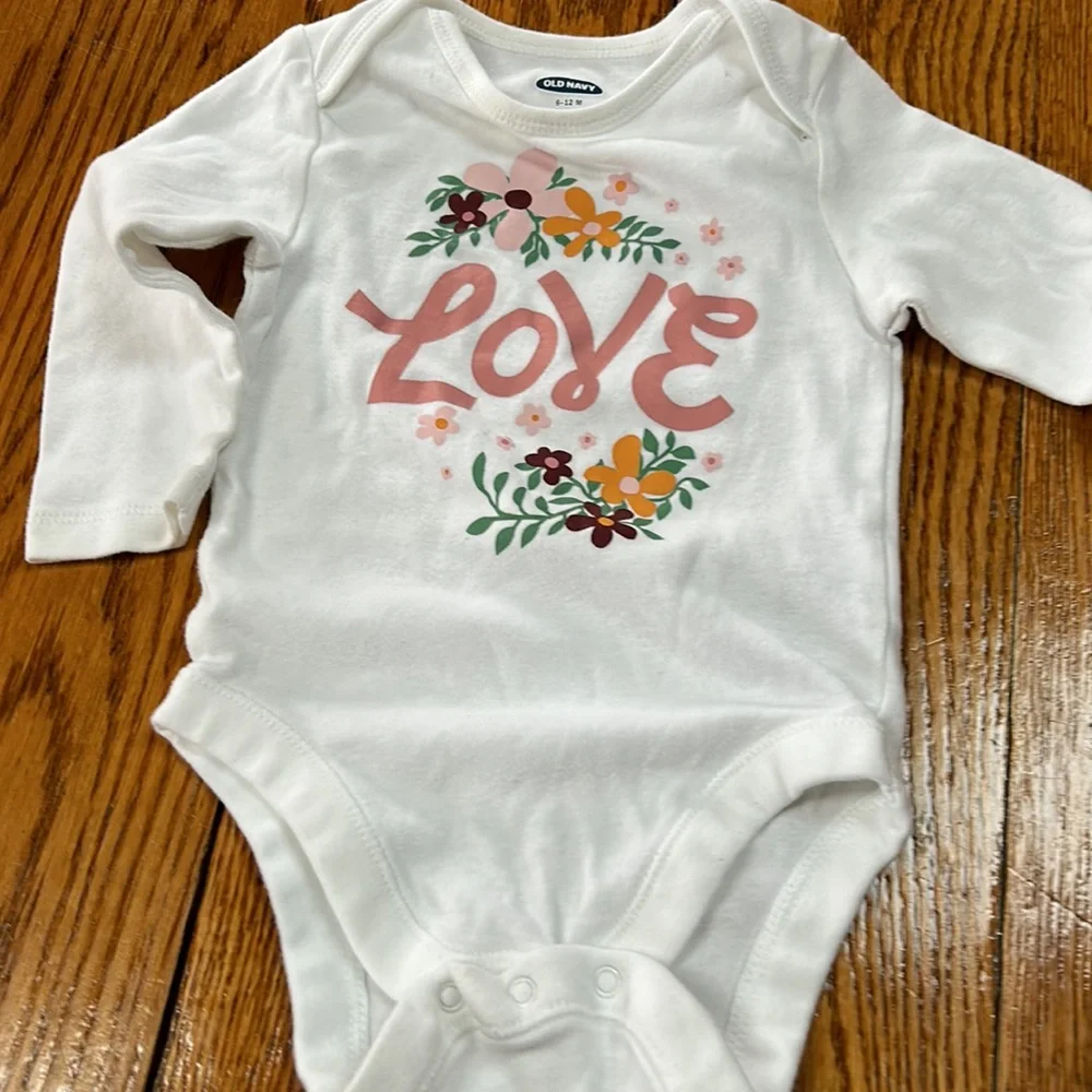 Old Navy white infant girls onsie.Long sleeve w/floral graphic & Love on front